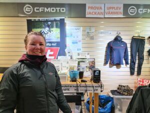 Woman trying on a heated jacket